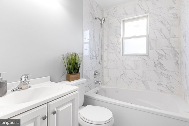 full bathroom featuring vanity, toilet, and tiled shower / bath