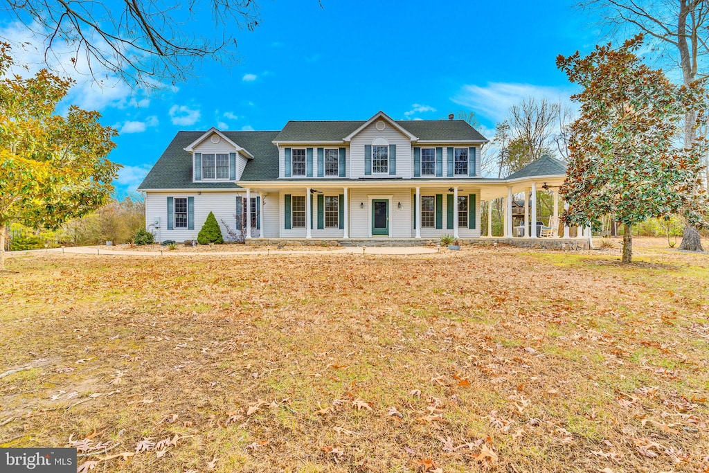 view of front of house featuring a front lawn and covered porch