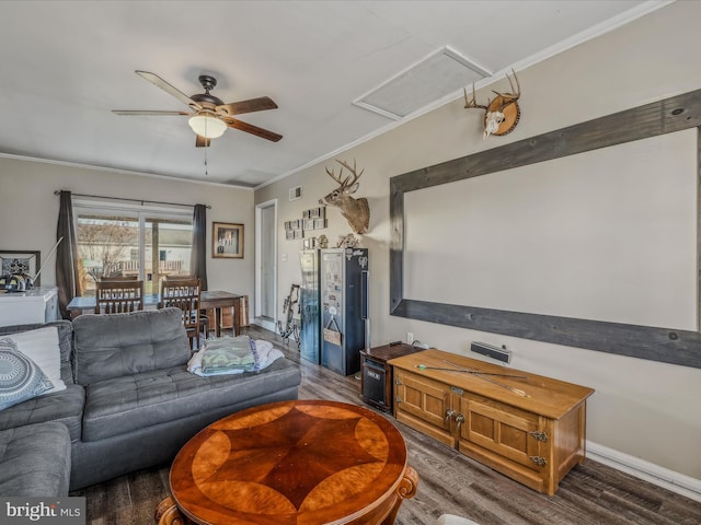 living room featuring ceiling fan, dark hardwood / wood-style flooring, and ornamental molding