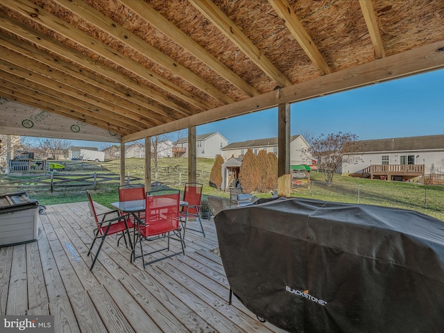 deck featuring a yard and area for grilling