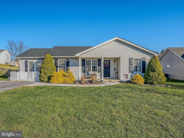 single story home featuring a front lawn