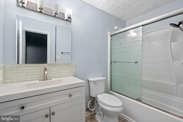 full bathroom with combined bath / shower with glass door, decorative backsplash, a textured ceiling, wood-type flooring, and toilet