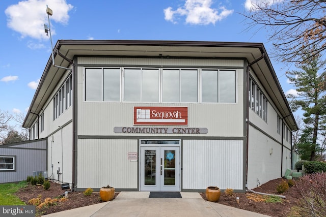 view of building exterior featuring central AC unit