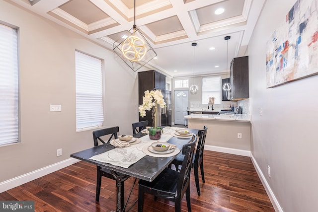 dining room with crown molding, dark hardwood / wood-style flooring, and coffered ceiling