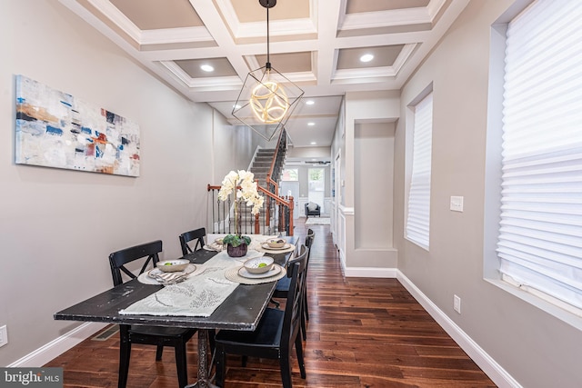 dining area featuring coffered ceiling, dark hardwood / wood-style flooring, beamed ceiling, crown molding, and a chandelier