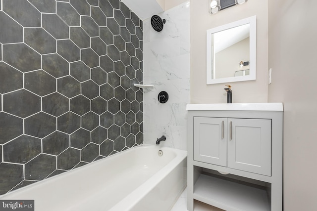 bathroom with vanity and tiled shower / bath