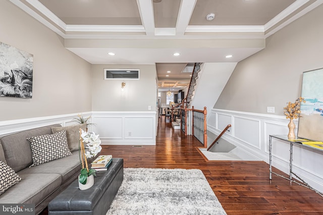 living room with beamed ceiling, dark hardwood / wood-style flooring, and crown molding