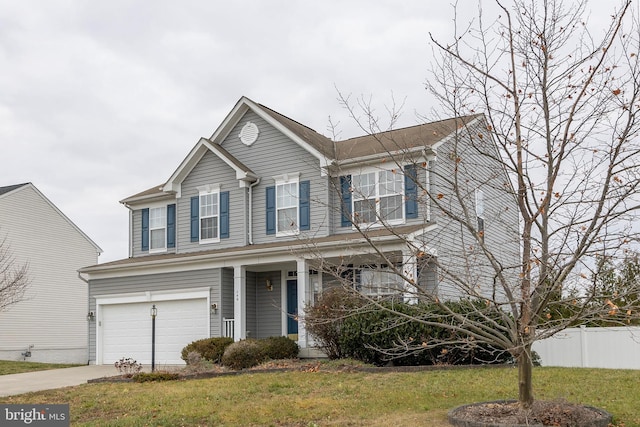 view of front of house featuring a front yard and a garage