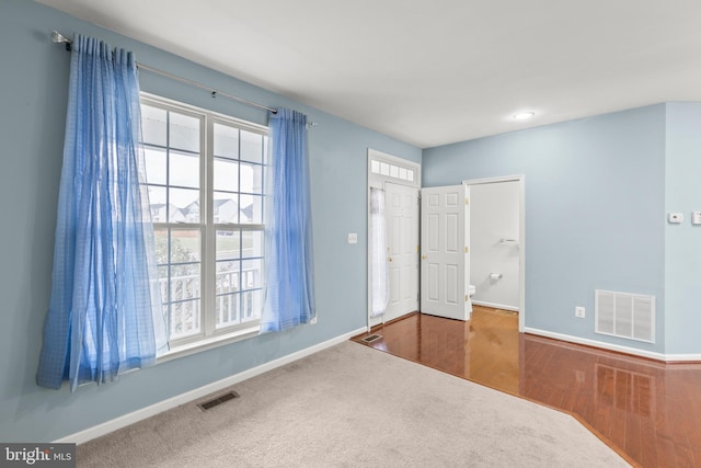 unfurnished bedroom featuring a closet and hardwood / wood-style flooring