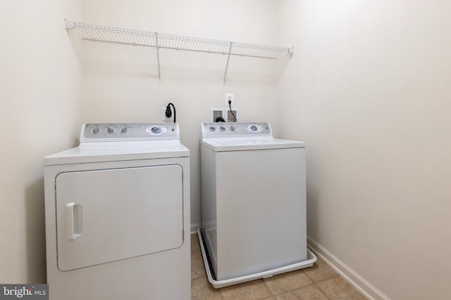 laundry room with washing machine and dryer