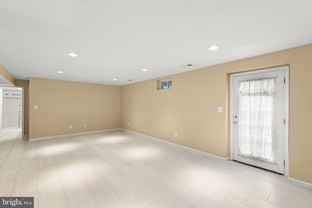 unfurnished room with light wood-type flooring