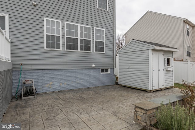 view of patio with a shed