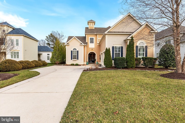 front facade with a front yard