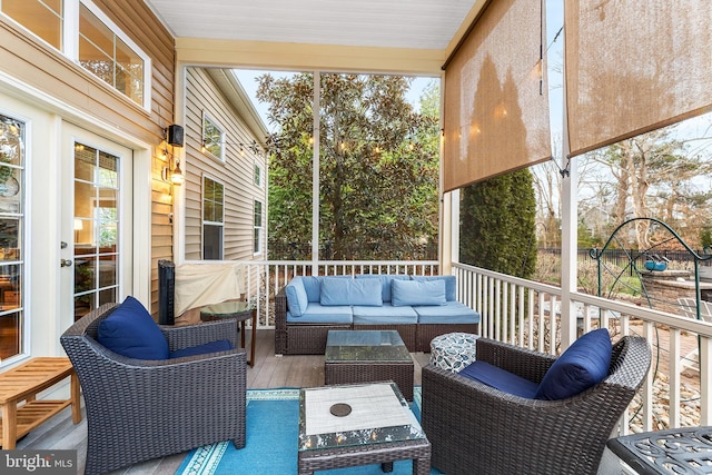 sunroom / solarium featuring a healthy amount of sunlight