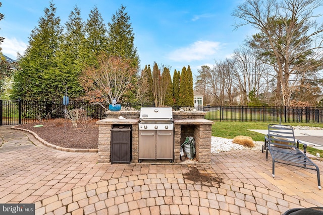 view of patio with a grill and exterior kitchen