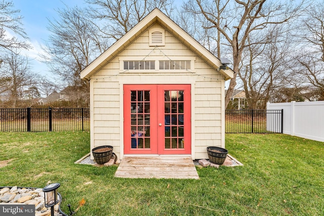 view of outbuilding with a lawn