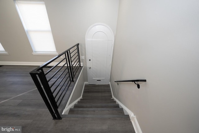 stairway featuring hardwood / wood-style flooring