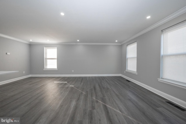 unfurnished room featuring dark hardwood / wood-style floors and crown molding