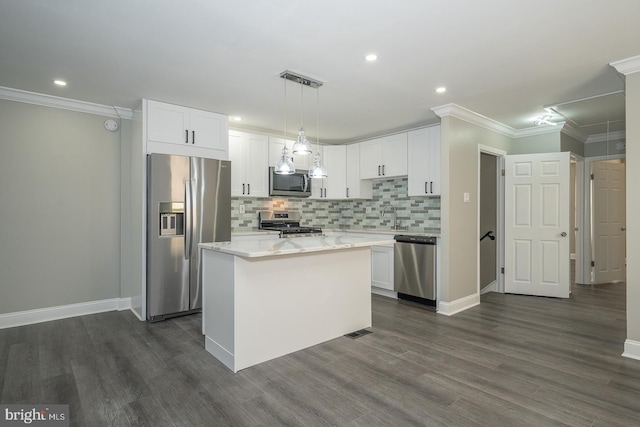 kitchen featuring a kitchen island, white cabinetry, and appliances with stainless steel finishes