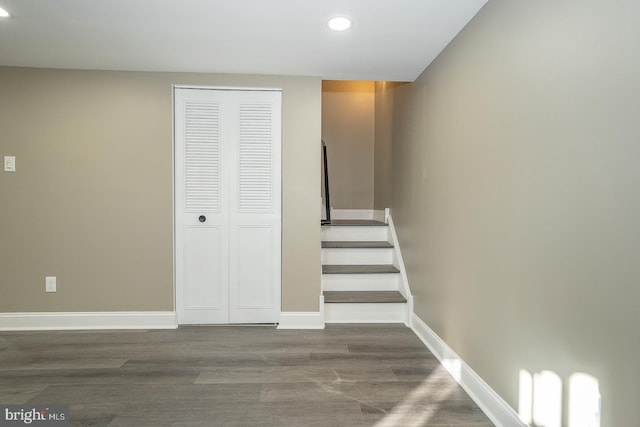 stairs with hardwood / wood-style flooring