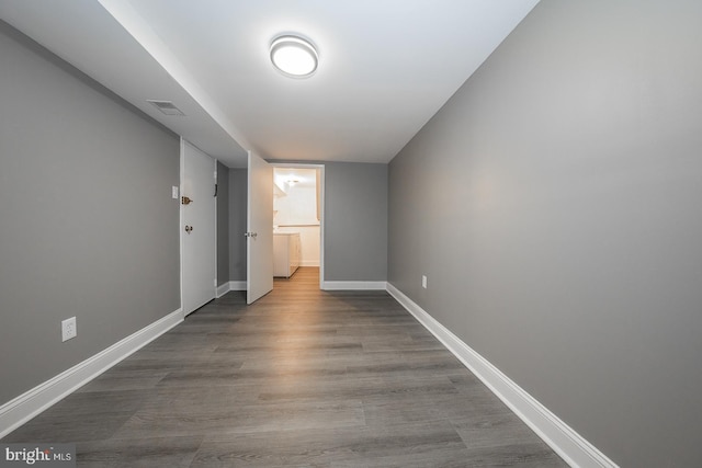 corridor featuring hardwood / wood-style flooring