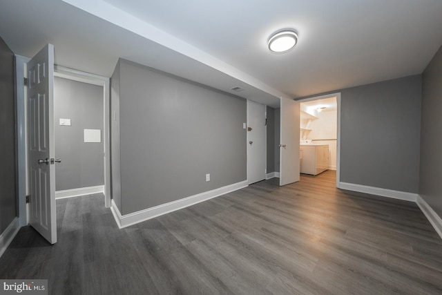 interior space with dark hardwood / wood-style flooring and separate washer and dryer