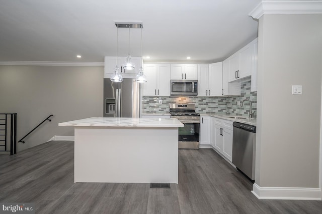 kitchen with a center island, white cabinetry, and stainless steel appliances