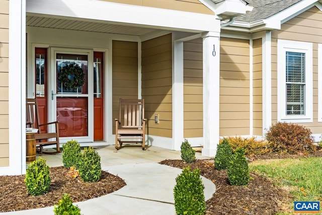 doorway to property featuring covered porch