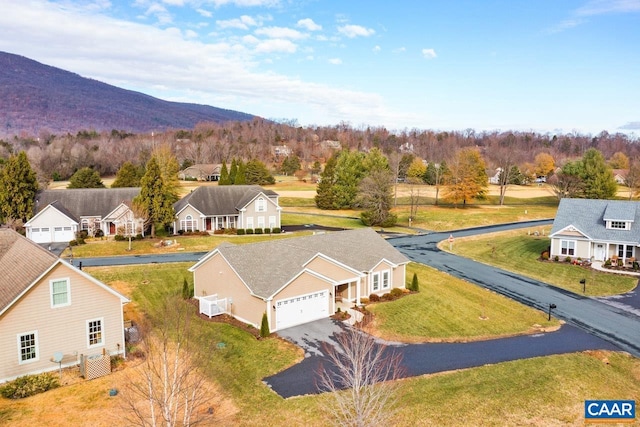 birds eye view of property featuring a mountain view