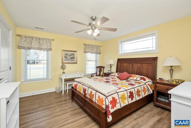 bedroom with wood-type flooring and ceiling fan