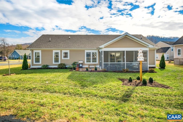 back of house featuring a lawn