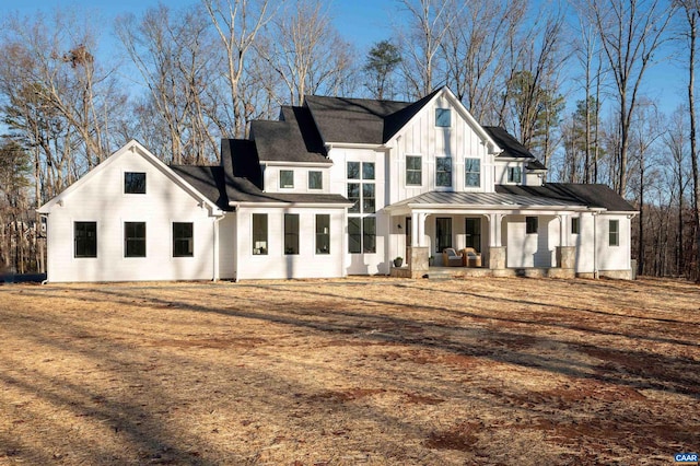 back of house featuring a porch