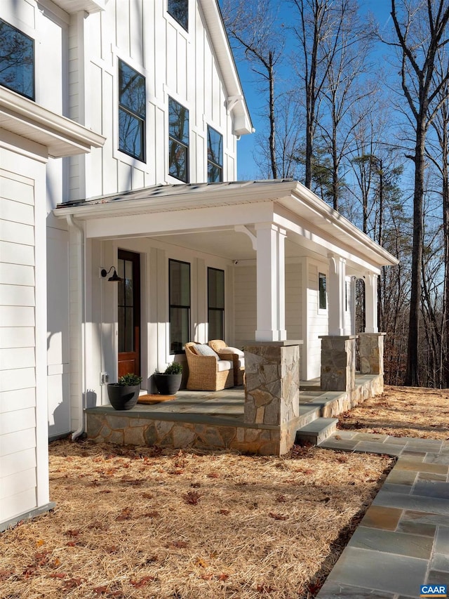 view of property exterior with covered porch