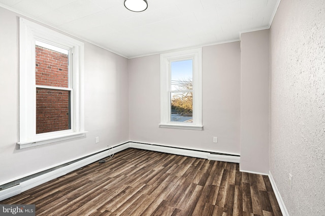 spare room featuring crown molding and dark wood-type flooring