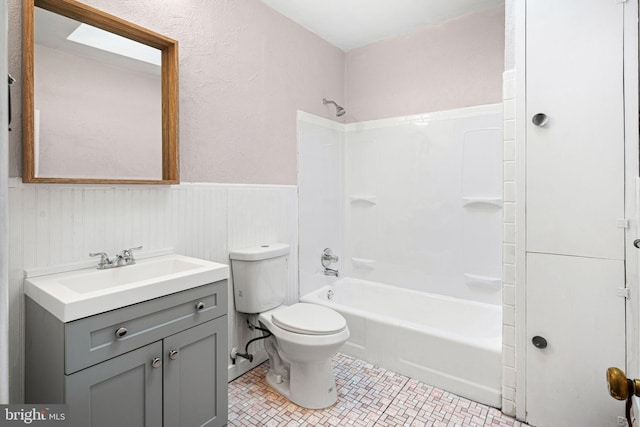 full bathroom featuring vanity, toilet, and tub / shower combination