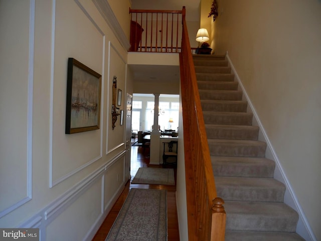 staircase featuring hardwood / wood-style flooring