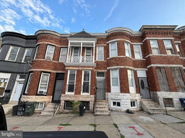 multi unit property featuring a balcony