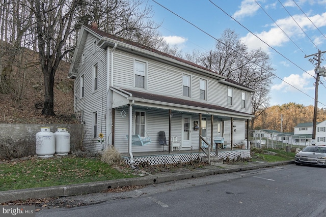 view of front property featuring covered porch