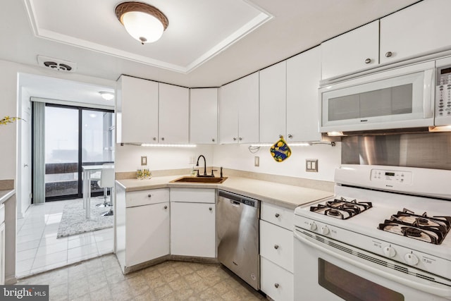 1326 Spruce St Unit 1908, Philadelphia, PA 19107 - kitchen with white appliances, light countertops, a raised ceiling, and white cabinets