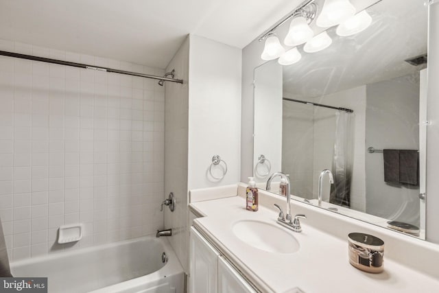 bathroom with shower / bath combination with curtain and vanity