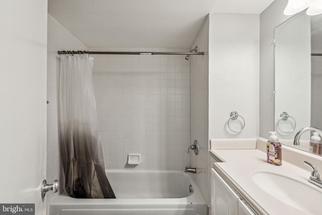 bathroom with shower / tub combo with curtain and vanity