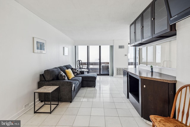 1326 Spruce St Unit 1908, Philadelphia, PA 19107 - living area with light tile patterned floors and baseboards