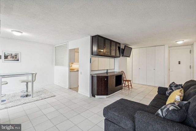 tiled living room with a textured ceiling