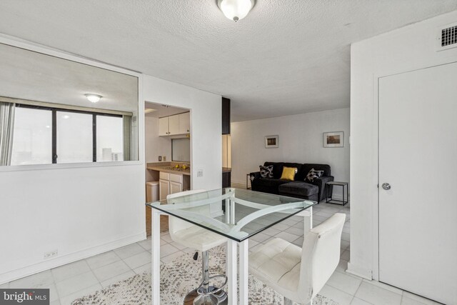 1326 Spruce St Unit 1908, Philadelphia, PA 19107 - dining space with light tile patterned floors and a textured ceiling