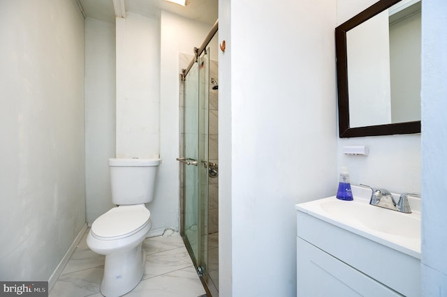 bathroom with vanity, toilet, and an enclosed shower