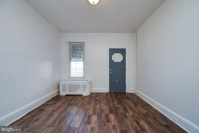 foyer entrance with dark hardwood / wood-style flooring