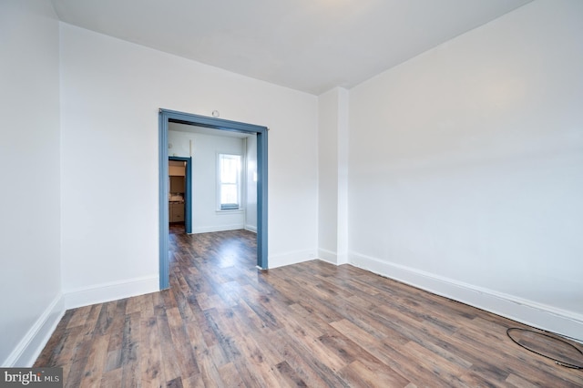 empty room with hardwood / wood-style floors