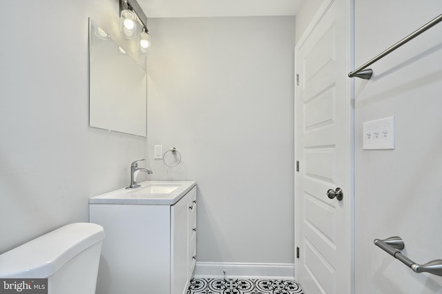 bathroom with vanity and toilet