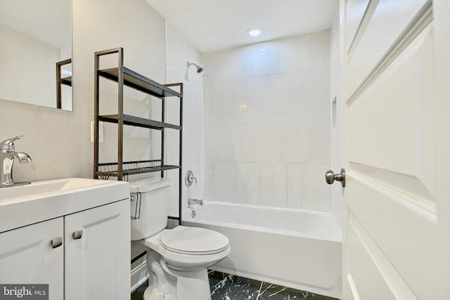 full bathroom with vanity, toilet, and tiled shower / bath combo