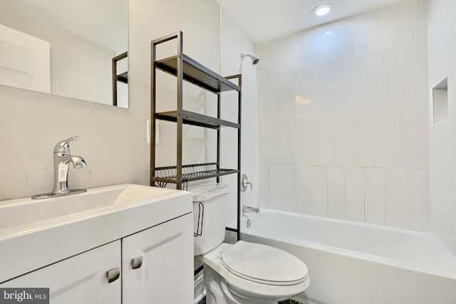 full bathroom with vanity, toilet, and tiled shower / bath combo